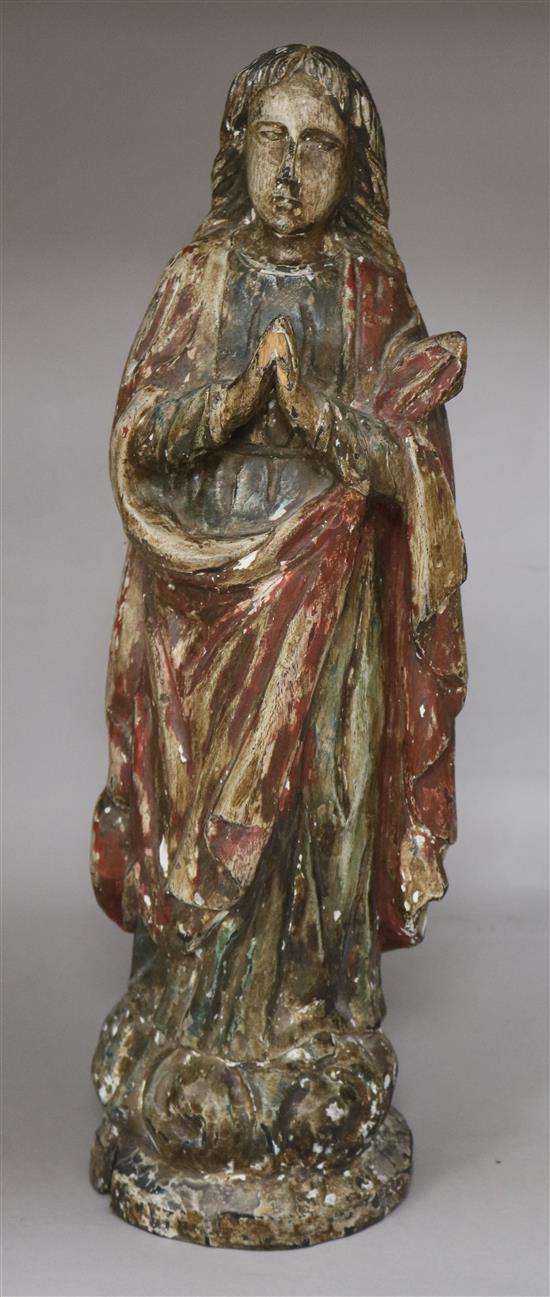 A carved figure of Mary Magdelene